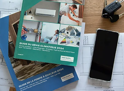 Deux catalogues Rexel sur des plans, avec un smartphone et des clés à Cormeilles-en-Parisis dans le Val d'Oise 95