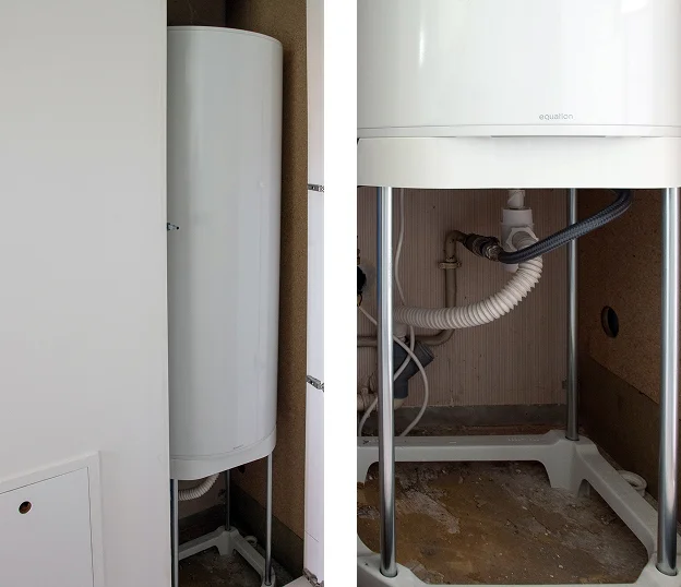 Chauffe-eau blanc Equation sur support métallique, avec tuyauterie visible en dessous à Cormeilles-en-Parisis dans le Val-d’Oise 95